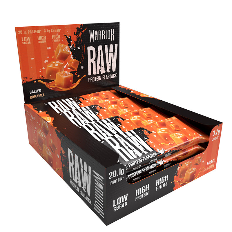Warrior Raw Protein Flapjack Salted Caramel Halal 64g Box with caramel pieces and packaging in a display.